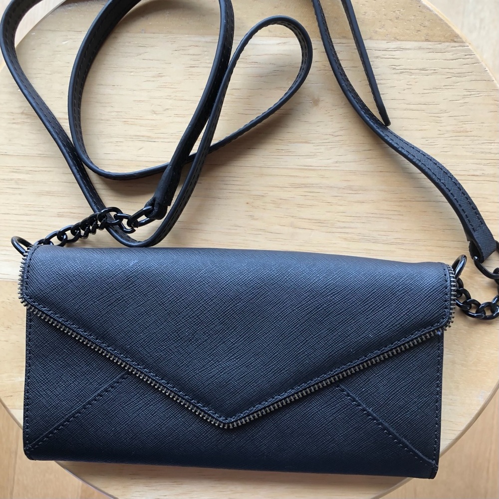 Rebecca Minkoff black crossbody wallet. Strap w/ chain detail. Interior pockets